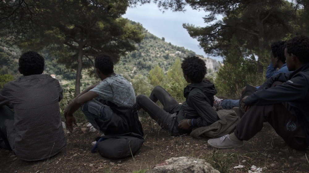 The boys rest near to the summit [Maurizio Martorana/Al Jazeera]