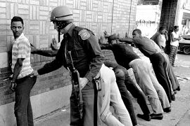 A man is taken into custody by police during riot in Detroit. The riots engulfed the city beginning July 23, 1967 and continued for five days - one of many to hit the U.S. that summer [Alvin Quinn/AP
