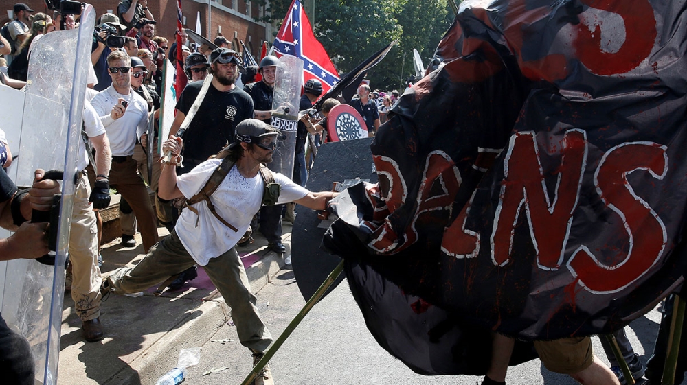 Far-right activists clash with counter-protesters at the rally [Joshua Roberts/Reuters]