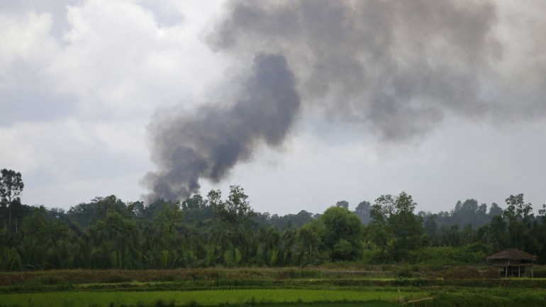 Plumes of smoke rise into the air from destroyed Rohingya villages in Myanmar Rohingya