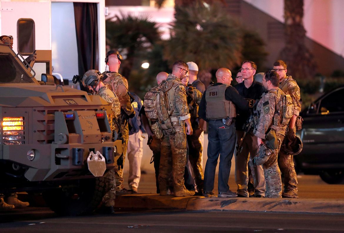 FBI agents confer in front of the Tropicana hotel-casino on October 2, 2017, after a mass shooting during a music festival on the Las Vegas Strip in Las Vegas, Nevada, U.S. REUTERS/Las Vegas Sun/Steve