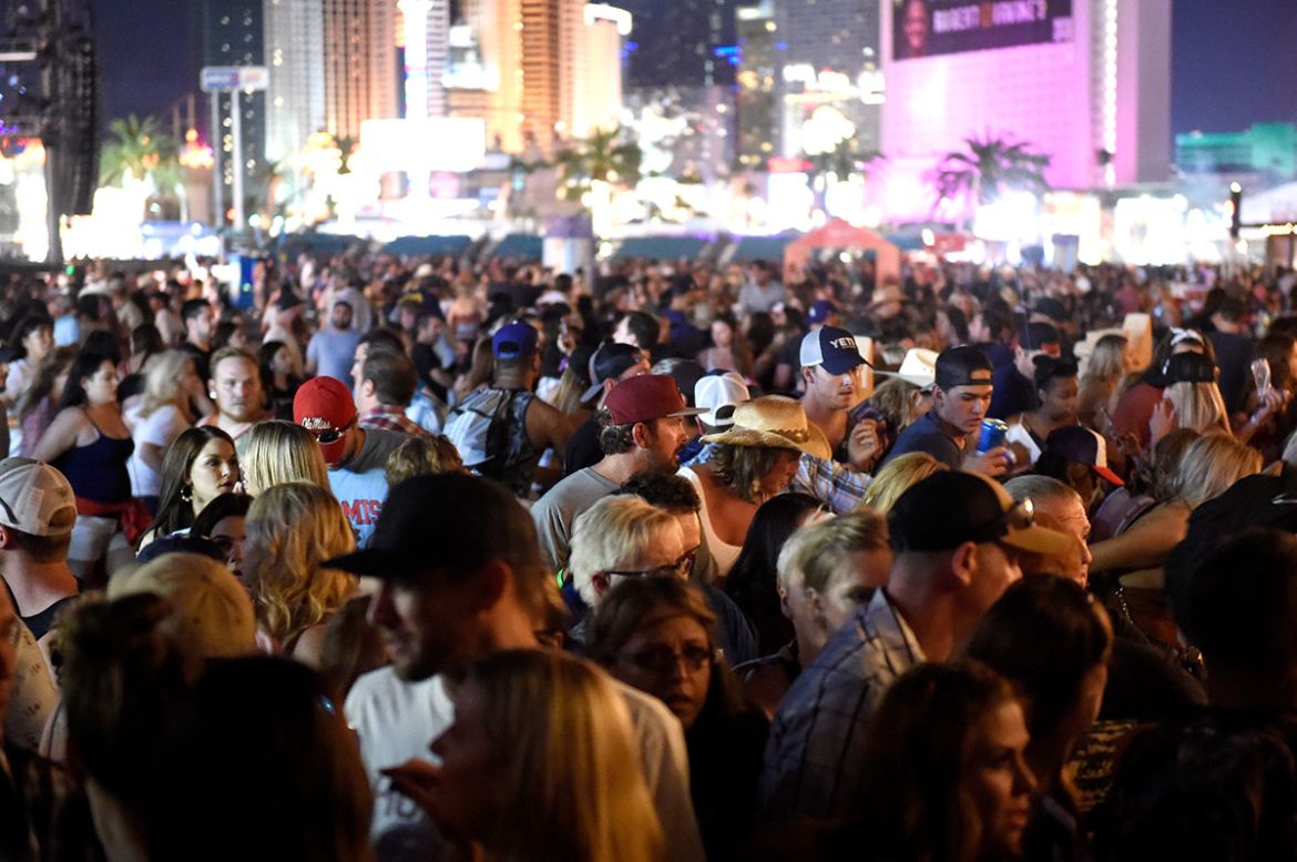 A crowd of people at the Route 91 Harvest country music festival after apparent gun fire was heard on October 1, 2017 in Las Vegas, Nevada. There are reports of an active shooter around the Mandalay B