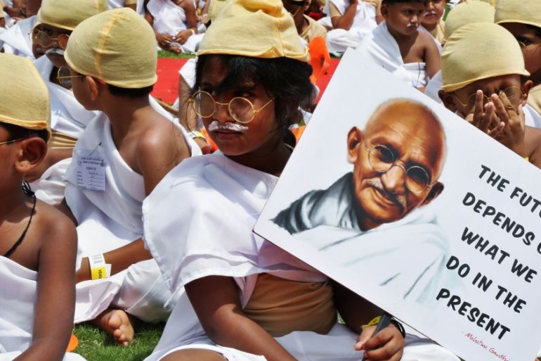 Indian school children dress as Mahatma Gandhi as they attempt to set a new world record as part of celebrations of the 146th anniversdary of the birth of Mahatma Gandhi in Bangalore, Indian, 02 Octob
