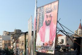 A poster depicting Saudi Crown Prince Mohammed bin Salman is seen in Tripoli