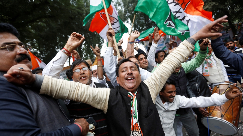 Supporters cheer in Delhi after Rahul's elevation to Congress presidency [Adnan Abidi/Reuters]