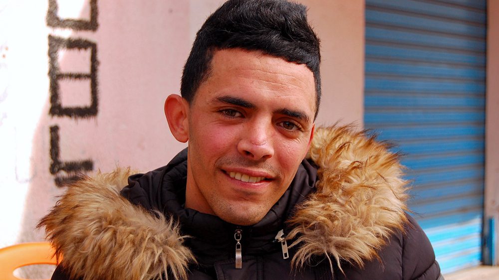 Montasser Khedher, 24, is among many Tunisians out of work from the impoverished suburb of Tunis [Jillian Kestler D'Amours/Al Jazeera]