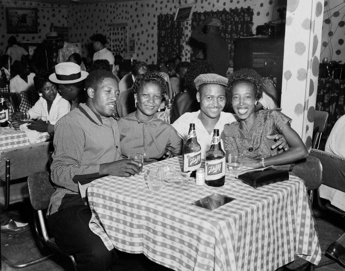 14: Revelers at a table in a Dallas nightclub in 1955. Hickman, like Littlejohn, continued for decades photographing his changing community. Hickman died in Dallas on 1 December 2007, while Littlejohn