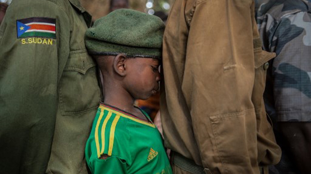 Child soldiers is an area that Ajak covers through her reporting [Stefanie Glinski/AFP]
