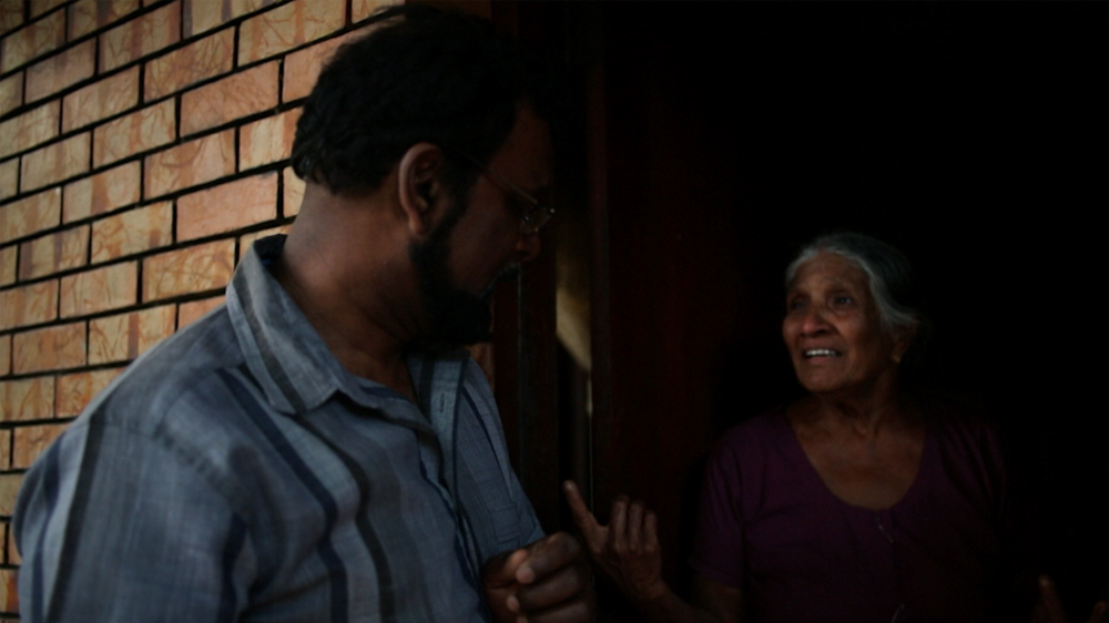 Manoranjan reconnects with the lady who sheltered his family from the Sri Lankan army three decades ago. [Screengrab/Al Jazeera]
