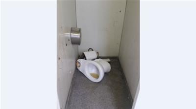A broken toilet in one of the communal bathrooms [Teo Kermeliotis/Al Jazeera]