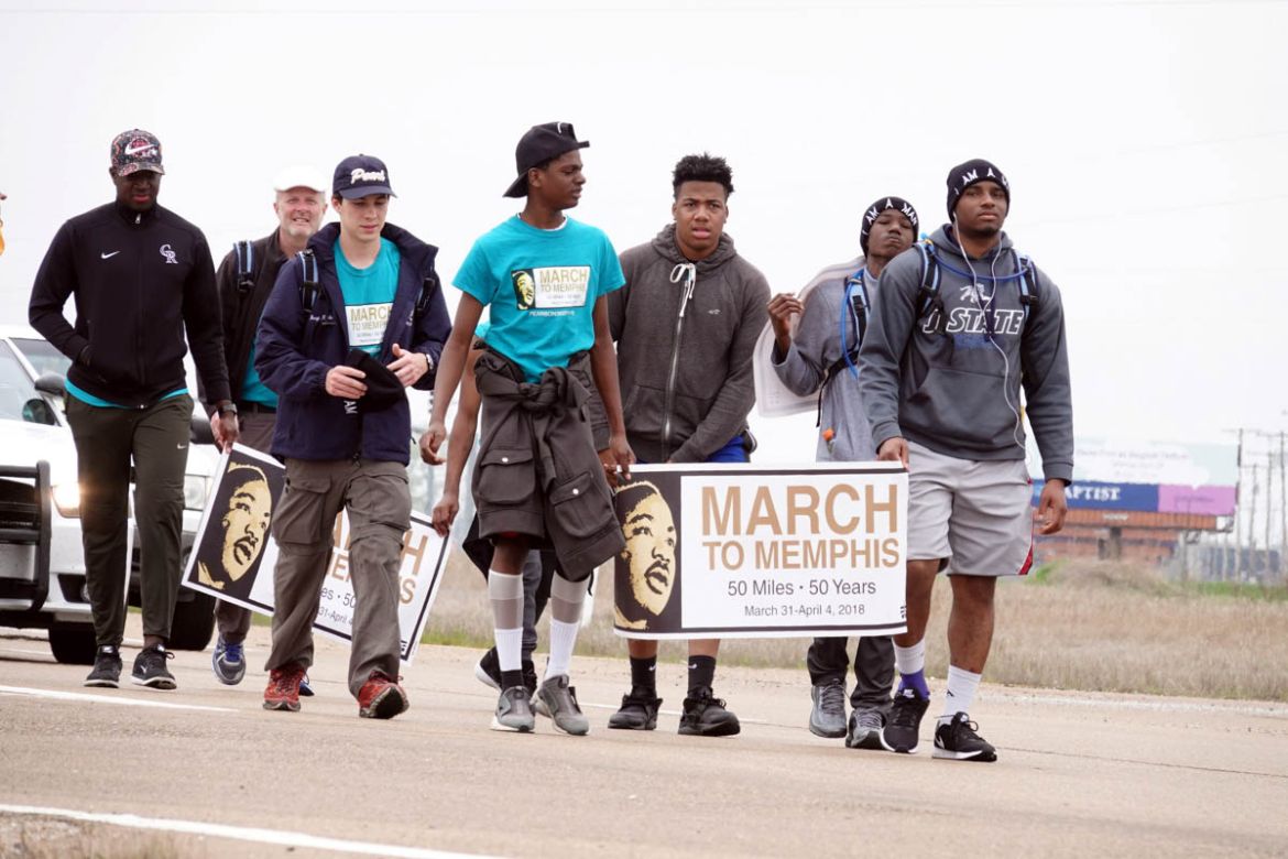 A group of teenagers from Pearl, Mississippi, walk along U.S. highway 61 just south of Memphis, on their 50-mile "March to Memphis" tribute to Martin Luther King., Jr. during events surrounding the 50