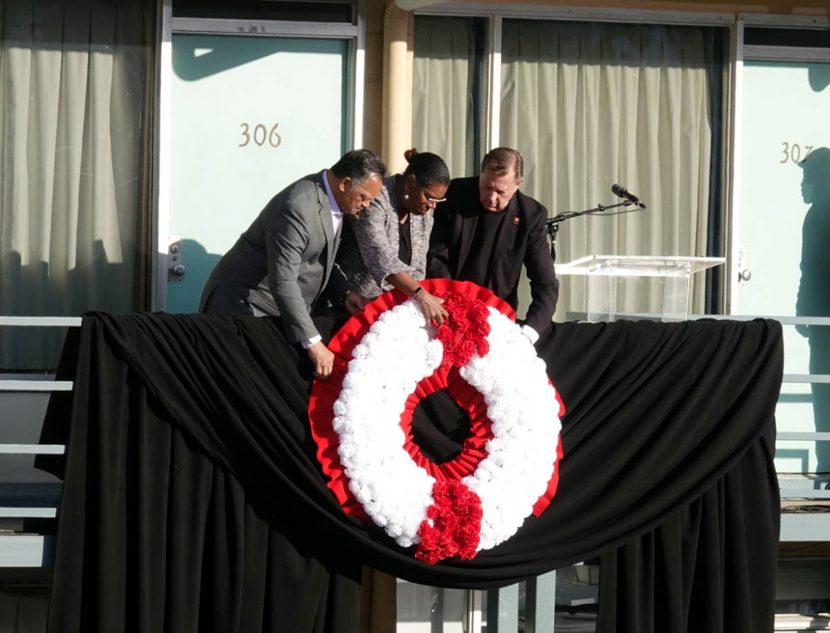 Rev. Jessie Jackson (left) pauses after placing a wreath on the balcony at the Lorraine Hotel, now the National Civil Right Museum, during events surrounding the 50th anniversary of the death of civil