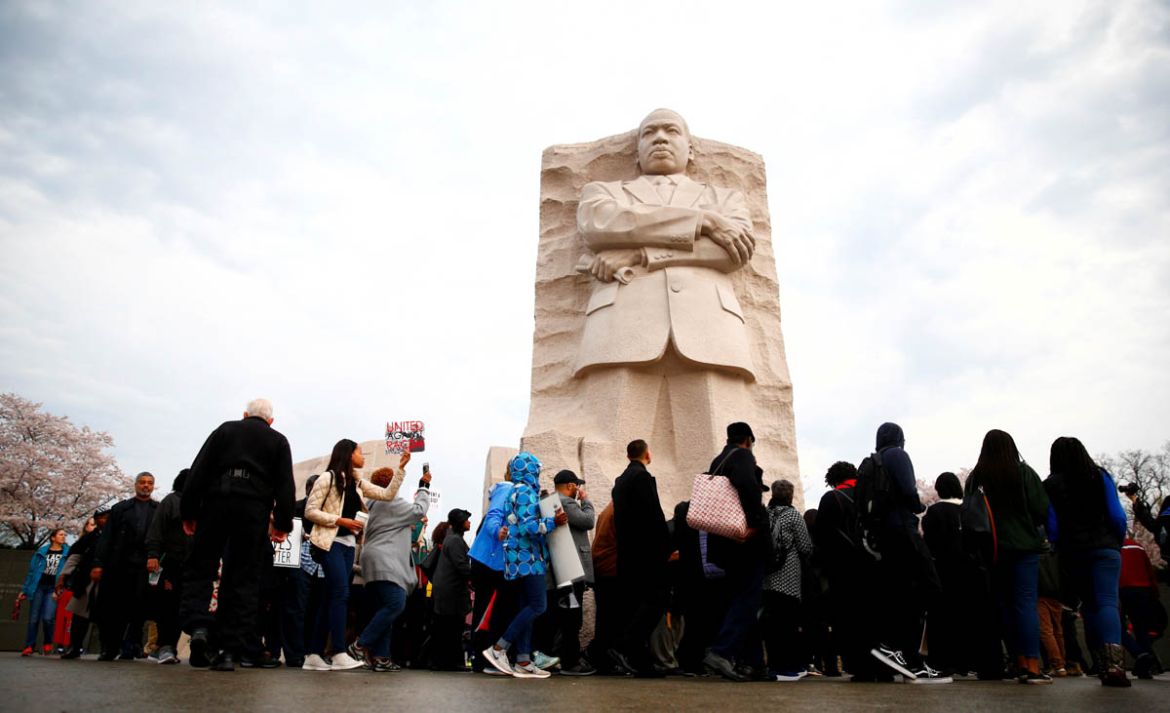 Attendees are seen during a silent march and rally on the National Mall to mark the 50th anniversary of the assassination of civil rights leader Rev. Martin Luther King Jr. in Washington, U.S., April