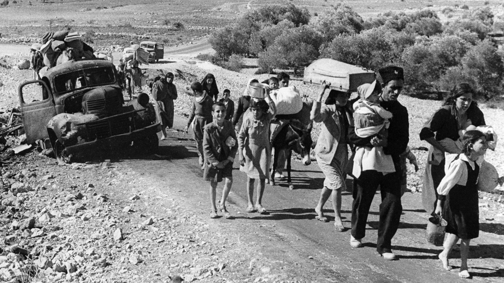 Refugees stream from Palestine in 1948 [Jim Pringle/AP]
