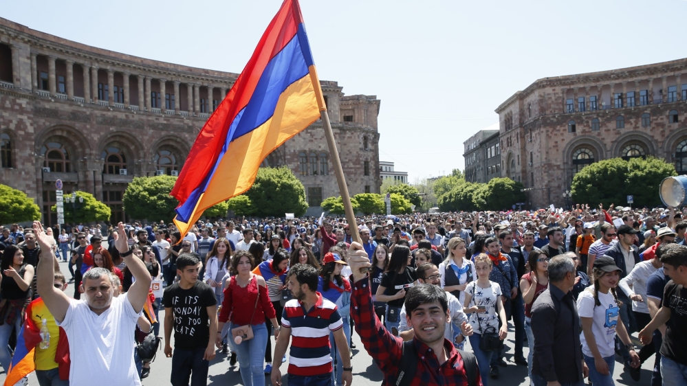 Armenian opposition supporters walk on the street after Nikol Pashinyan announced a nationwide campaign of civil disobedience in Yerevan, in May 2018. [Gleb Garanich/Reuters]