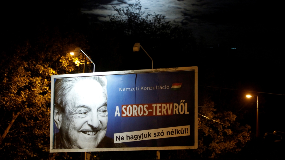 A government billboard displaying George Soros next to a message urging Hungarians to take part in a national consultation about what it calls a plan by the Hungarian-born financier to settle a million migrants in Europe every year [Bernadett Szabo/Reuters]