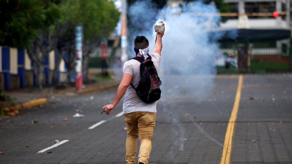 A demonstrator fires a homemade mortar towards the riot police during a protest against Nicaragua's President Daniel Ortega's government in Managua [Oswaldo Rivas/Reuters]