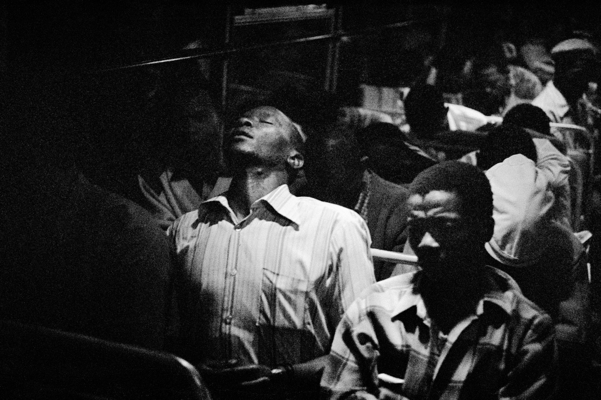 Going home: Marabastad-Waterval route: for most of the people in this bus, the cycle will start again tomorrow between 2 and 3am, 1984 [Photograph by David Goldblatt]