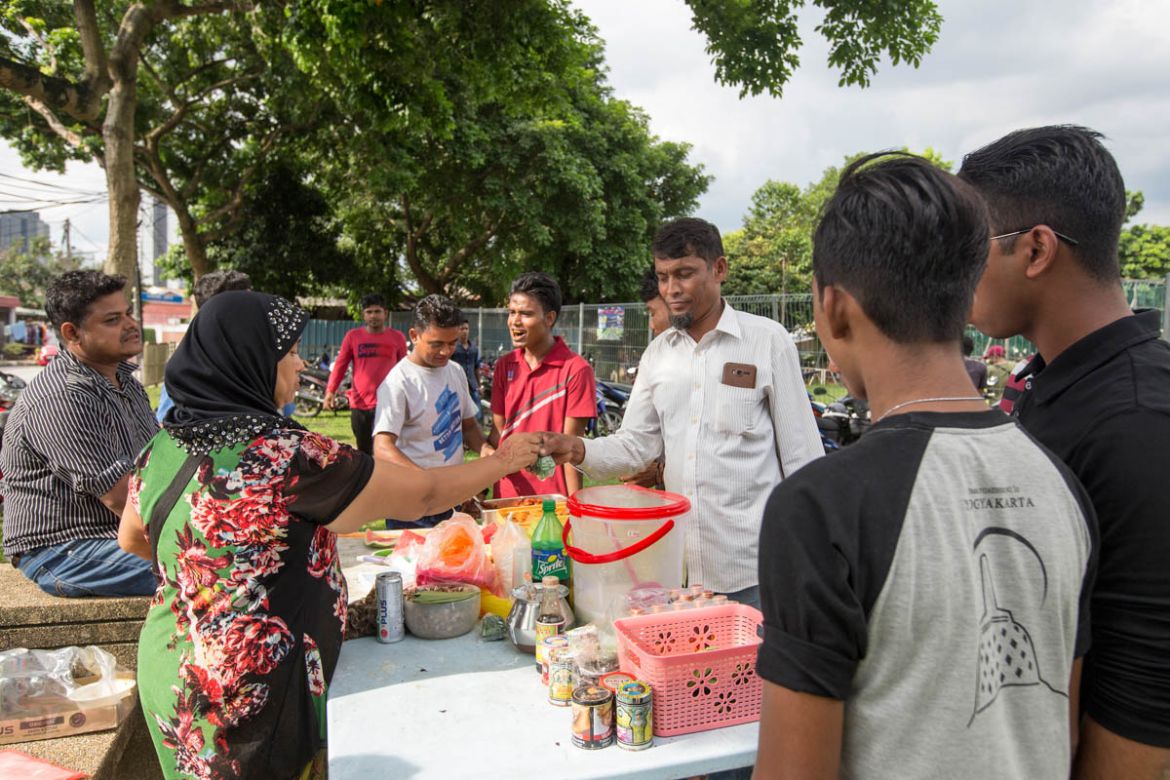 Fatimah cooks and sells food at every football event, as her husband plays in one of the local teams. She arrived in Malaysia as a child 30 years ago and raised a family of 6 in the country. At every