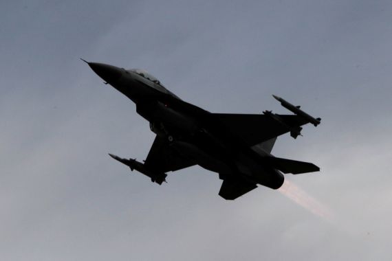 A F-16 fighter jet takes off during a military drill at Zhi-Hang Air Base in Taitung