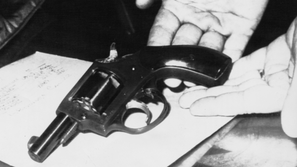 An officer presents on June 6, 1968, the handgun, a .22 calibre Iver-Johnson revolver, with which Senator Robert Kennedy was shot at the Ambassador Hotel in Los Angeles [File photo: AP]