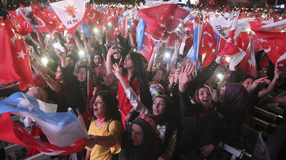Supporters of Erdogan and his AK Party celebrate in Ankara following the president's victory [AFP]