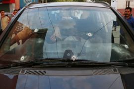 Bullet marks are seen on the car of Syed Shujaat Bukhari, the editor of Rising Kashmir daily newspaper, after unidentified gunmen attacked him outside his office in Srinagar