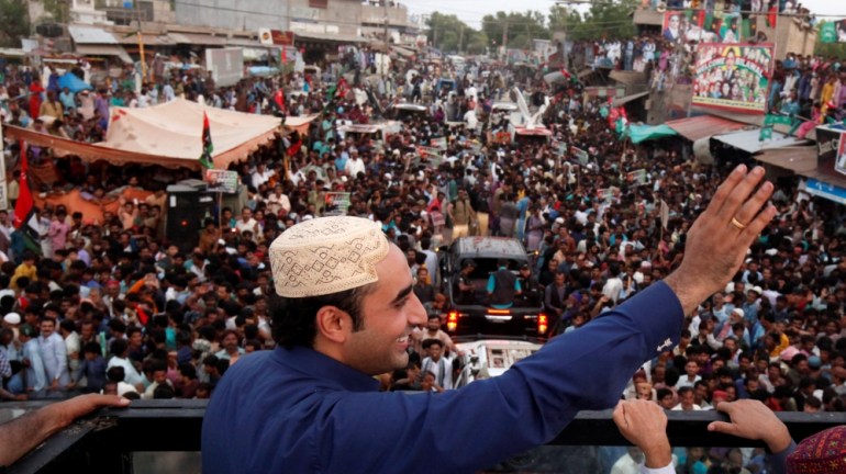 Bilawal Bhutto Zardari, chairman of the Pakistan People''s Party, speaks to supporters from roof of bullet-proof bus, during campaign rally ahead of general elections