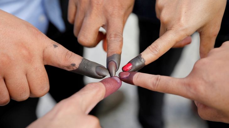 Cambodian voters take pictures of their ink stained fingers after they voted, outside a polling station during a general election in Phnom Penh, Cambodia July 29, 2018. REUTERS/Darren Whiteside TPX IM