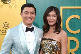 Henry Golding, left, and Gemma Chan arrive at the premiere of "Crazy Rich Asians" at the TCL Chinese Theatre on Tuesday, Aug. 7, 2018, in Los Angeles. (Photo by Richard Shotwell/Invision/AP)