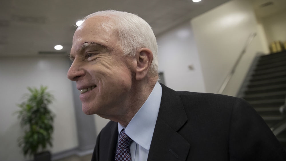 McCain returned to Washington, DC, after just being diagnosed to vote against bill that would have repealed Obamacare healthcare law [J Scott Applewhite/AP Photo]