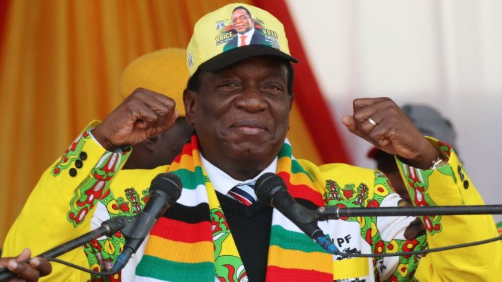 FILE PHOTO: President Emmerson Mnangagwa greets supporters of his ruling ZANU PF party gather for an election rally in Chinhoyi