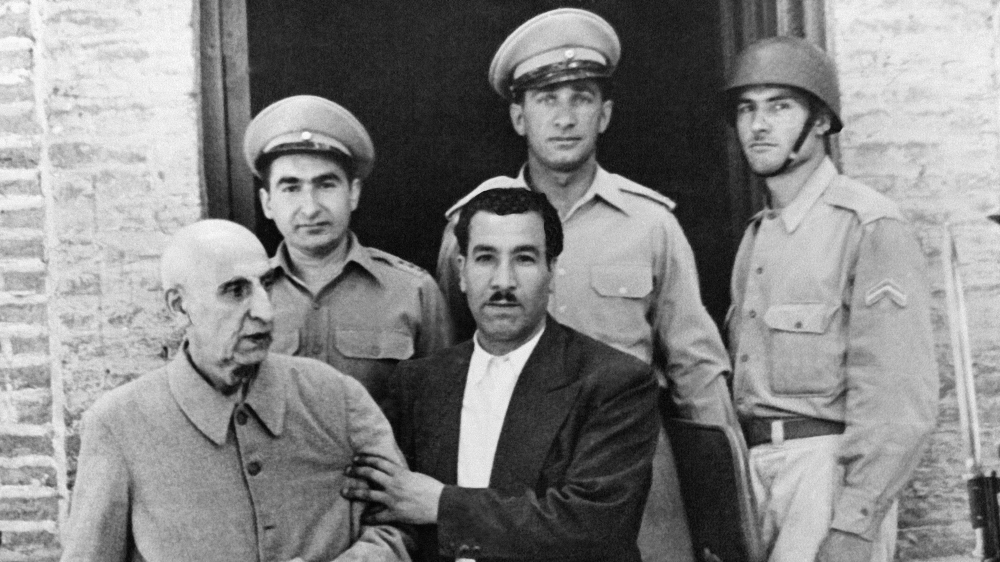 Mossadegh (L) after being released from Ghasser Barracks in northern Tehran on August 4, 1956, after three years of imprisonment on charges of treason [File: AP]