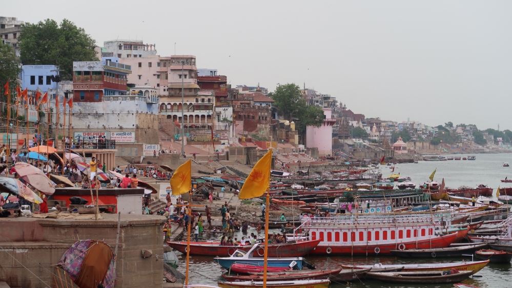 The banks of the holy Ganges River in Varanasi are crowded with people as worshippers perform prayers and spiritual rituals in the morning [Karishma Vyas/Al Jazeera]