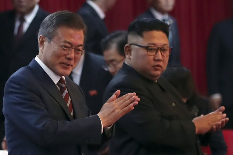 South Korean President Moon Jae-in, left, and North Korean leader Kim Jong Un arrive at the Pyongyang Grand Theatre in Pyongyang, North Korea, Tuesday, Sept. 18, 2018. President Moon Jae-in began his