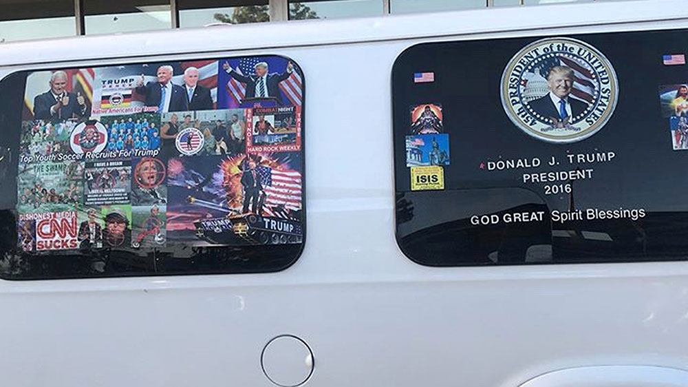 A van with windows covered in pro-Trump and anti-Democrat stickers, apprehended on October 26, 2018, during an investigation into a series of parcel bombs, in Hollywood, Florida [File: Geo Rodriguez/Reuters] 