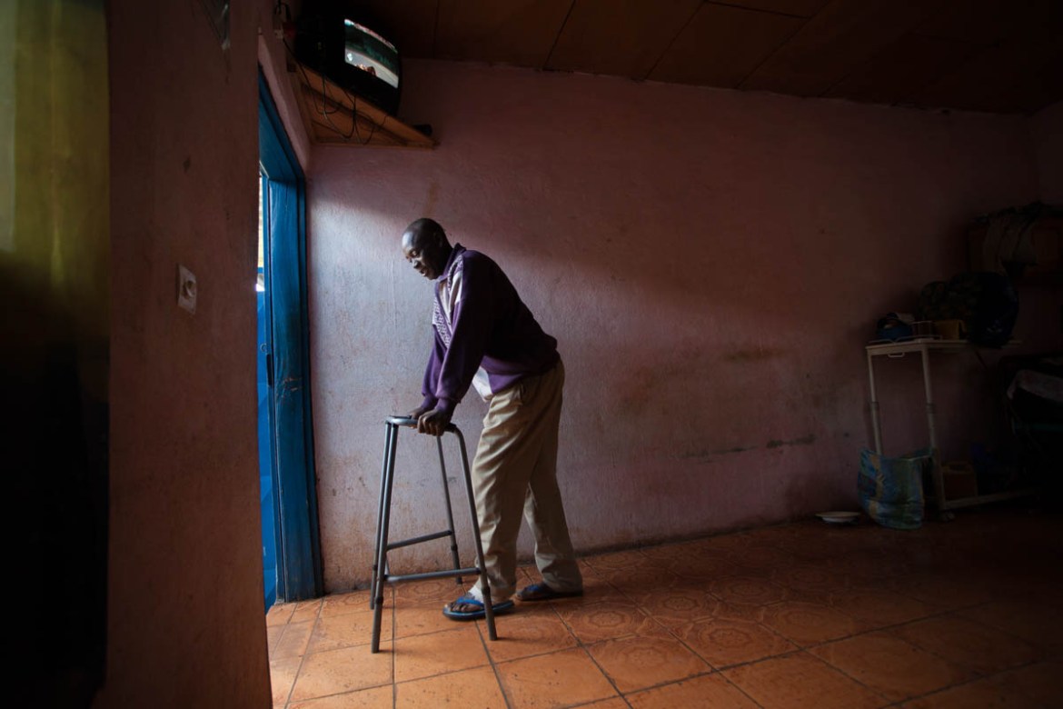 Maurice Takou, 50, leaves his room to wait for the daily dressing change. He''s been in the wound hospital for a month, but his wound is three years old. He describes the beginning of the ulcer: "A sma