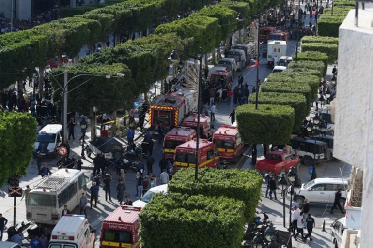 EDITORS NOTE: Graphic content / A picture taken on October 29, 2018, shows police and firemen gathering at the site of a suicide attack in the centre of the Tunisian capital Tunis. - A woman blew hers