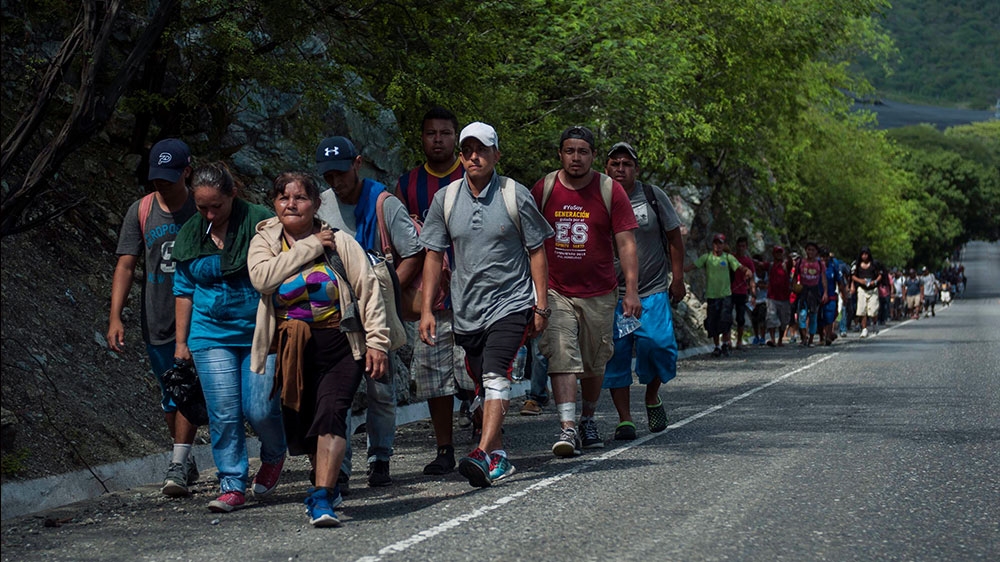 Honduras migrants walk to the U.S as they approach Zacapa, about 70 miles northeast of Guatemala City, Wednesday [File: Oliver de Ros/Reuters] 