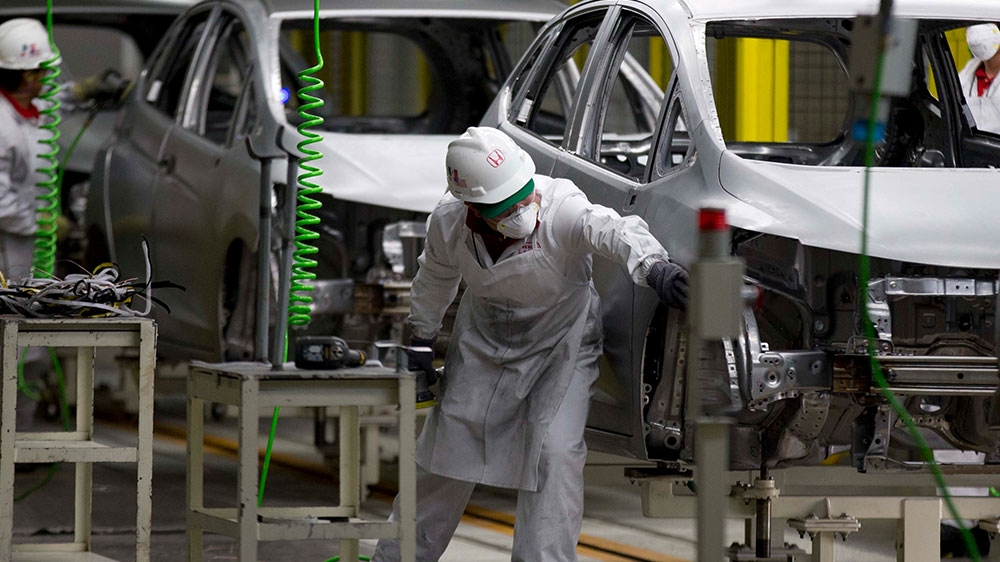 
The deal strengthens made-in-North-America rules by upping the percentage of car parts that must be manufactured in North America from 62.5 to 75 percent [File: Eduardo Verdugo/AP Photo]
