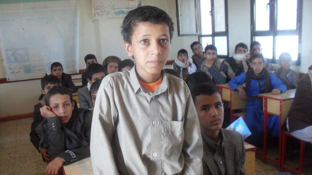 Ahmed Ali Hanash attends class at his school which lost pupils in an August 2018 Saudi-led air raid on a school bus in Saada province [Naseh Shaker/Al Jazeera]