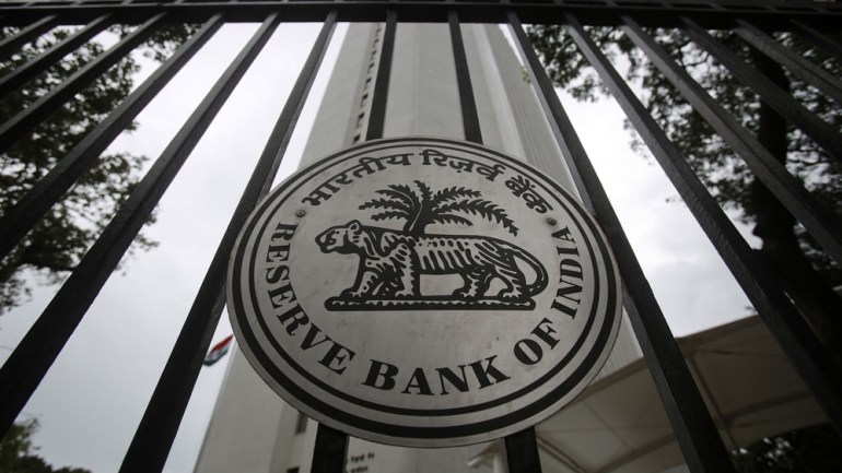 The Reserve Bank of India logo on an outside gate.