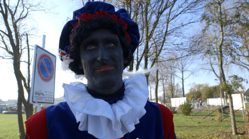 Every year, adults and children dress up as Zwarte Piet [Micah Garen/Al Jazeera]