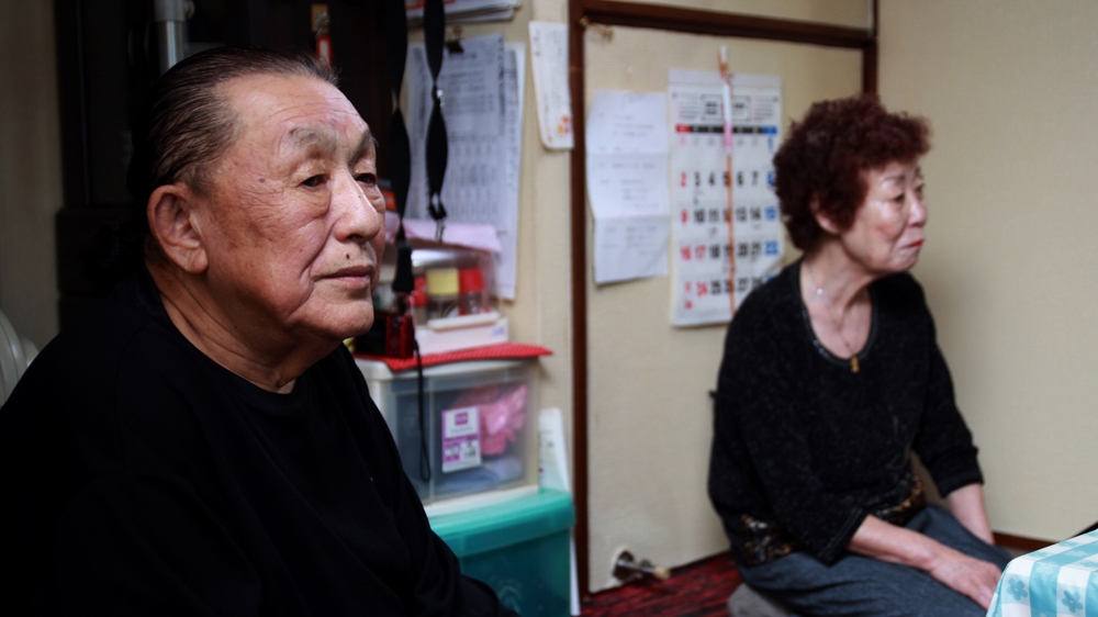 After 57 years of silence, Kikuo Kojima told his wife Reiko that he was one of 25,000 people sterilised by the Japanese government [Al Jazeera]