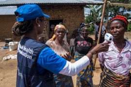 Dr Marie-Roseline Darnycka Bélizaire, World Health Organization (WHO) epidemiology team lead, talks to women as part of Ebola contact tracing, in Mangina, Democratic Republic of the Congo, on August 26, 2018 [WHO/Junior Kannah/Handout via Reuters]