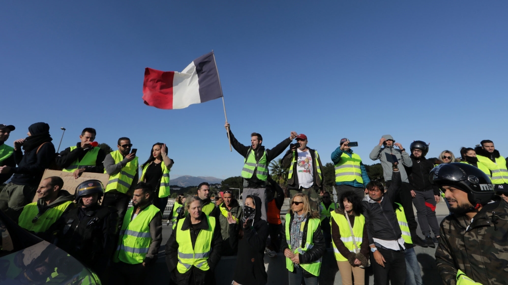 A group of protesters blocking a motorway in Antibes [Eric Gaillard/Reuters]