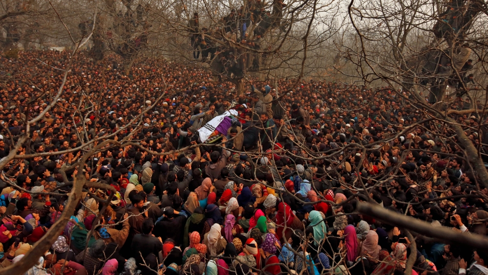People at the funeral of Mohd Waseem Wagay, a suspected rebel, at Amshipora village in south Kashmir's Shopian district [Danish Ismail/Reuters]
