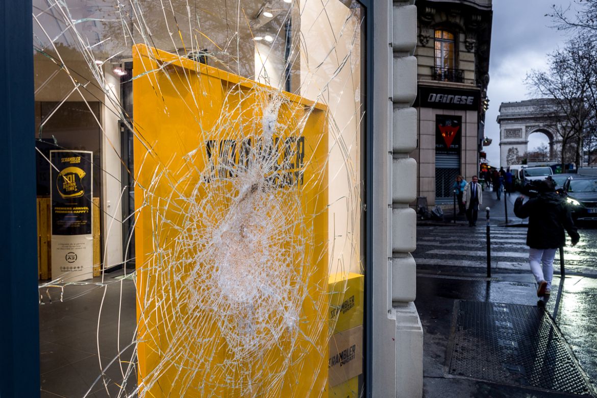 A smashed front window of a Ducati store is seen on a street near the Champs ElysE`es on December 03, 2018 in Paris, France. French Ministry of Economy Bruno Le Maire has estimated the loss in busines