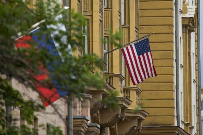 U.S. and Russian flags hung at the U.S. Embassy in Moscow, Russia, Friday, July 28, 2017. Russia''s Foreign Ministry on Friday ordered a reduction in the number of U.S. diplomats in Russia and said it