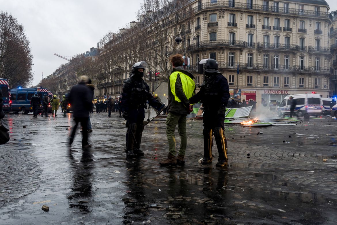 A yellow vest protester is being arrested by police officers during clashes between police forces and violent groups on December 01, 2018 in Paris, France. Some 270 people have been arrested and at le